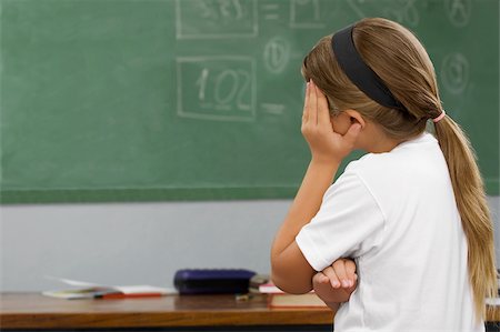 photograph chaotic table - Side profile of a schoolgirl looking sad Stock Photo - Premium Royalty-Free, Code: 625-02931570