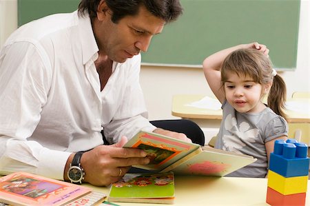 simsearch:625-02929760,k - Male teacher teaching his student in a classroom Stock Photo - Premium Royalty-Free, Code: 625-02931814