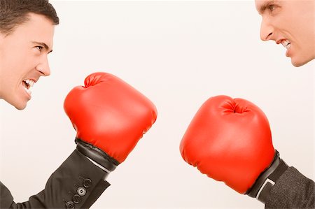 disdain - Side profile of two businessmen boxing Stock Photo - Premium Royalty-Free, Code: 625-02931894