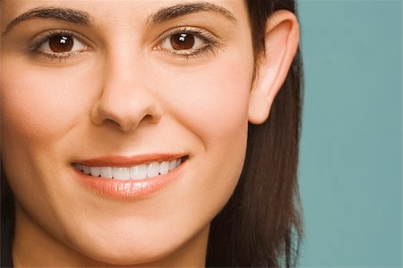 simsearch:625-02267530,k - Portrait of a young woman smiling Stock Photo - Premium Royalty-Free, Code: 625-02931896
