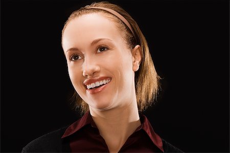 simsearch:625-02931241,k - Close-up of a businesswoman smiling Fotografie stock - Premium Royalty-Free, Codice: 625-02931907