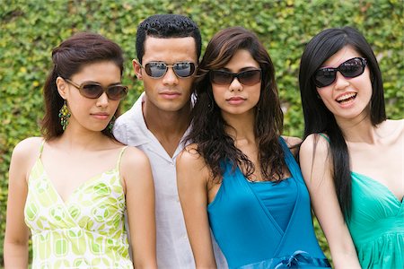 simsearch:625-02267530,k - Close-up of a mid adult man standing with three young women Stock Photo - Premium Royalty-Free, Code: 625-02931976