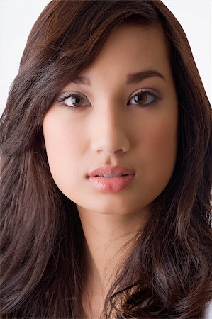 Portrait of a young woman looking serious Stock Photo - Premium Royalty-Free, Code: 625-02932098
