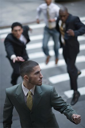High angle view of business executives chasing a businessman Foto de stock - Sin royalties Premium, Código: 625-02932093