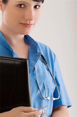 simsearch:625-02929220,k - Portrait of a female doctor with a file Stock Photo - Premium Royalty-Free, Code: 625-02932109