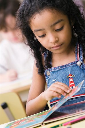simsearch:625-02929760,k - Close-up of a girl looking at a picture book Stock Photo - Premium Royalty-Free, Code: 625-02932256