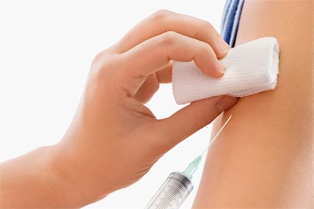 Close-up of a doctor giving injection to a patient Foto de stock - Sin royalties Premium, Código: 625-02932380