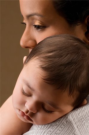 simsearch:625-02267467,k - Close-up of a young woman carrying her son Stock Photo - Premium Royalty-Free, Code: 625-02932472