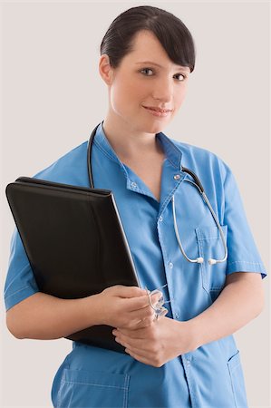 simsearch:625-02929220,k - Portrait of a female doctor with a file Stock Photo - Premium Royalty-Free, Code: 625-02932652