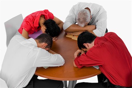 simsearch:625-02266977,k - High angle view of three businessmen and a businesswoman resting their heads on a table Stock Photo - Premium Royalty-Free, Code: 625-02932733
