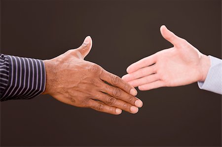 Close-up of two businesspeople shaking hands Stock Photo - Premium Royalty-Free, Code: 625-02932748