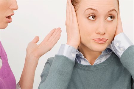 Businesswoman gesturing with her colleague ignoring her Foto de stock - Sin royalties Premium, Código: 625-02932923