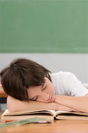 sleeping in classroom - Schoolboy napping on a desk in a classroom Stock Photo - Premium Royalty-Free, Code: 625-02932957