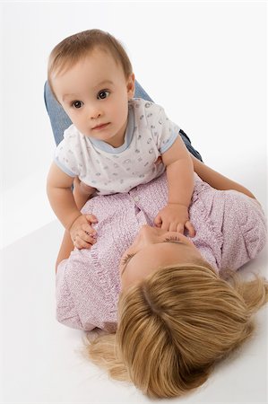 simsearch:625-02267506,k - Close-up of a mid adult woman playing with her baby boy Stock Photo - Premium Royalty-Free, Code: 625-02933047