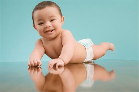 diaper toddler portraits - Portrait of a baby boy smiling Stock Photo - Premium Royalty-Free, Code: 625-02933092