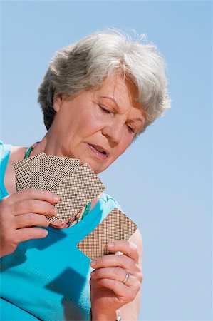 simsearch:625-02932391,k - Close-up of a senior woman playing cards Stock Photo - Premium Royalty-Free, Code: 625-02933127