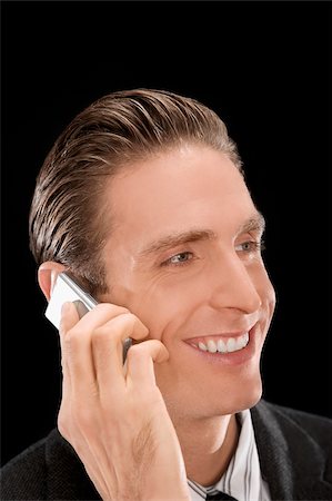 simsearch:625-02932799,k - Close-up of a businessman talking on a mobile phone and smiling Foto de stock - Sin royalties Premium, Código: 625-02933226