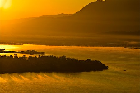 Panoramic view of a lake at dusk, Janitzio Island, Lake Patzcuaro, Morelia, Michoacan State, Mexico Stock Photo - Premium Royalty-Free, Code: 625-02933287