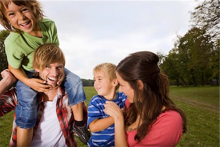 family bright colours - Happy parents with sons in park, Munich, Bavaria, Germany Stock Photo - Premium Royalty-Free, Code: 628-05817233