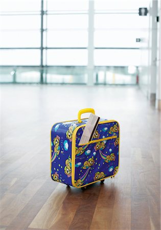 suitcase not illustration not monochrome and nobody - A suitcase of a child with ticket, Munich airport, Bavaria, Germany Stock Photo - Premium Royalty-Free, Code: 628-05817445