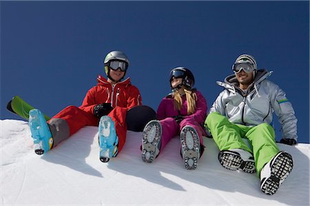 snowboard helmet - Snowboarder and skiers sitting at halfpipe Stock Photo - Premium Royalty-Free, Code: 628-05817546