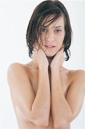 female body front view - Young woman taking a shower Stock Photo - Premium Royalty-Free, Code: 628-05817542