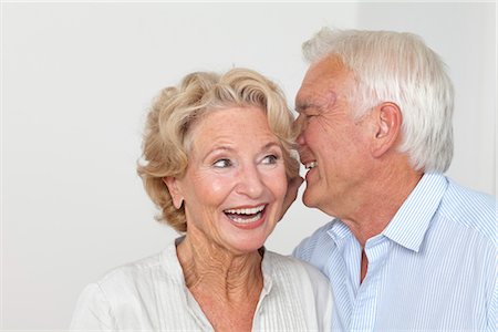 surprised people white background - Senior couple whispering Stock Photo - Premium Royalty-Free, Code: 628-05817564