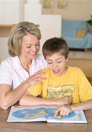 school kid european - Mother and son looking into atlas Stock Photo - Premium Royalty-Free, Code: 628-05817595