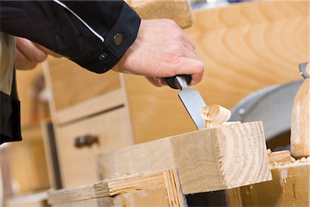 Carpenter working on wood with plane Fotografie stock - Premium Royalty-Free, Codice: 628-05817606