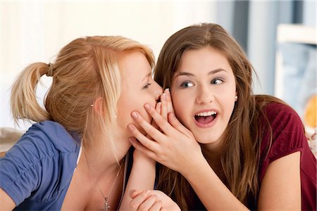 secretive - Two teenage girls whispering Stock Photo - Premium Royalty-Free, Code: 628-05817617