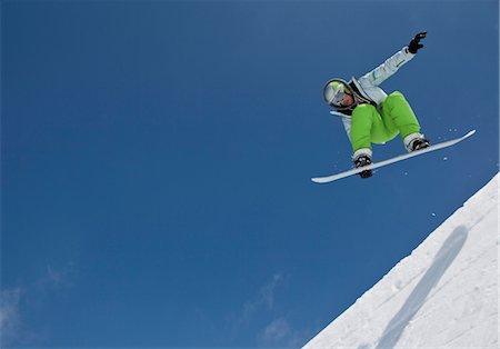 picture of people jumping in the snow - Snowboarder midair in halfpipe Stock Photo - Premium Royalty-Free, Code: 628-05817610