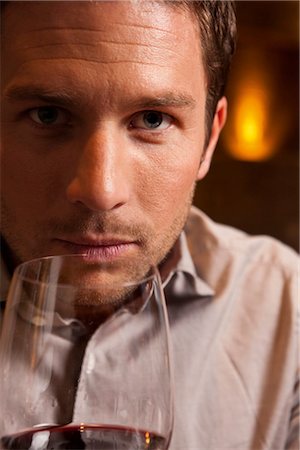expert (male) - Man smelling at red wine Stock Photo - Premium Royalty-Free, Code: 628-05817613