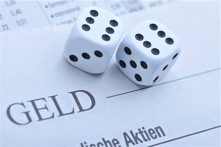 dice game picture - Dices on newspaper with stock prices Stock Photo - Premium Royalty-Free, Code: 628-05817689