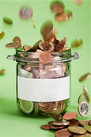 floating (object on water) - Euro coins falling in jar Stock Photo - Premium Royalty-Free, Code: 628-05817704