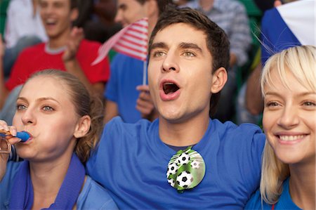 enthusiastic fans - Fans in a soccer stadium Stock Photo - Premium Royalty-Free, Code: 628-05817771