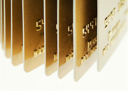 simsearch:695-03386967,k - Gold credit cards in a row Stock Photo - Premium Royalty-Free, Code: 628-05818011