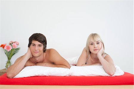 Couple lying in bed, Munich, Bavaria, Germany Stock Photo - Premium Royalty-Free, Code: 628-05818094