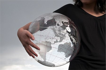 someone holding ball - Girl holding transparent globe outdoors Stock Photo - Premium Royalty-Free, Code: 628-07072076