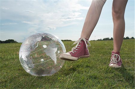 Girl standing in meadow with transparent globe Stock Photo - Premium Royalty-Free, Code: 628-07072094