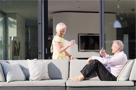 peace person pool - Senior couple with glasses of water on the terrace Stock Photo - Premium Royalty-Free, Code: 628-07072175