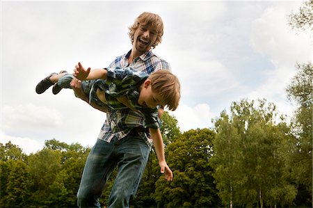 simsearch:628-07072359,k - Playful father and son outdoors Stock Photo - Premium Royalty-Free, Code: 628-07072287