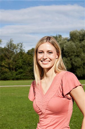 Smiling young woman outdoors Stock Photo - Premium Royalty-Free, Code: 628-07072303
