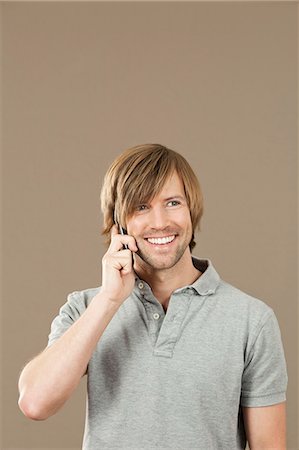 simsearch:628-07072352,k - Man in gray polo shirt on the phone Stock Photo - Premium Royalty-Free, Code: 628-07072319
