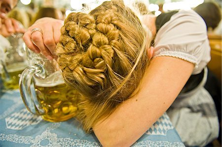 simsearch:400-07294051,k - Exhausted woman with beer mug on the Oktoberfest in Munich, Bavaria, Germany Stock Photo - Premium Royalty-Free, Code: 628-07072366