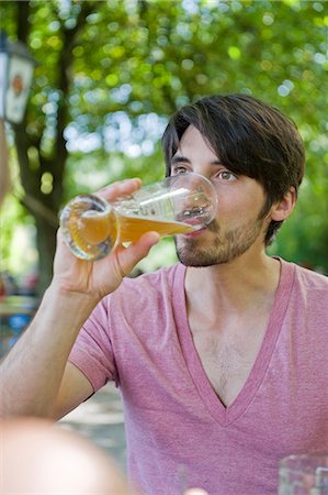 simsearch:6115-07109843,k - Man drinking beer in beer garden Stock Photo - Premium Royalty-Free, Code: 628-07072362