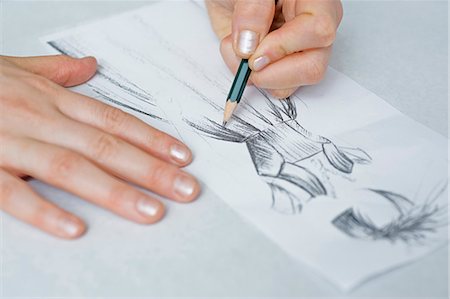 design sketches - Tailoress drawing in sketchbook Stock Photo - Premium Royalty-Free, Code: 628-07072409