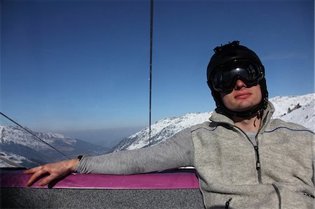 Man in chair lift, Hochfuegen, Zillertal, Tyrol, Austria Photographie de stock - Premium Libres de Droits, Code: 628-07072443