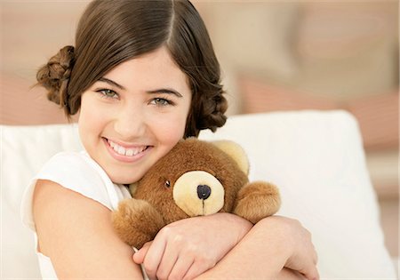 Girl hugging teddy bear Stock Photo - Premium Royalty-Free, Code: 628-07072525