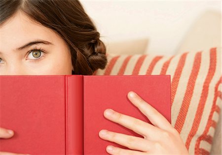 preteen eyes - Girl holding a book Stock Photo - Premium Royalty-Free, Code: 628-07072526