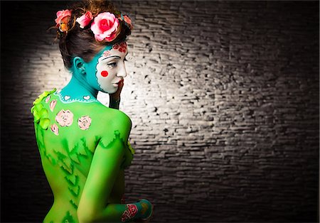 Young woman with traditional Asian body painting, rear view Stock Photo - Premium Royalty-Free, Code: 628-07072950